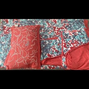 Lightweight colorful quilt with two pillow shams and decorative pillow